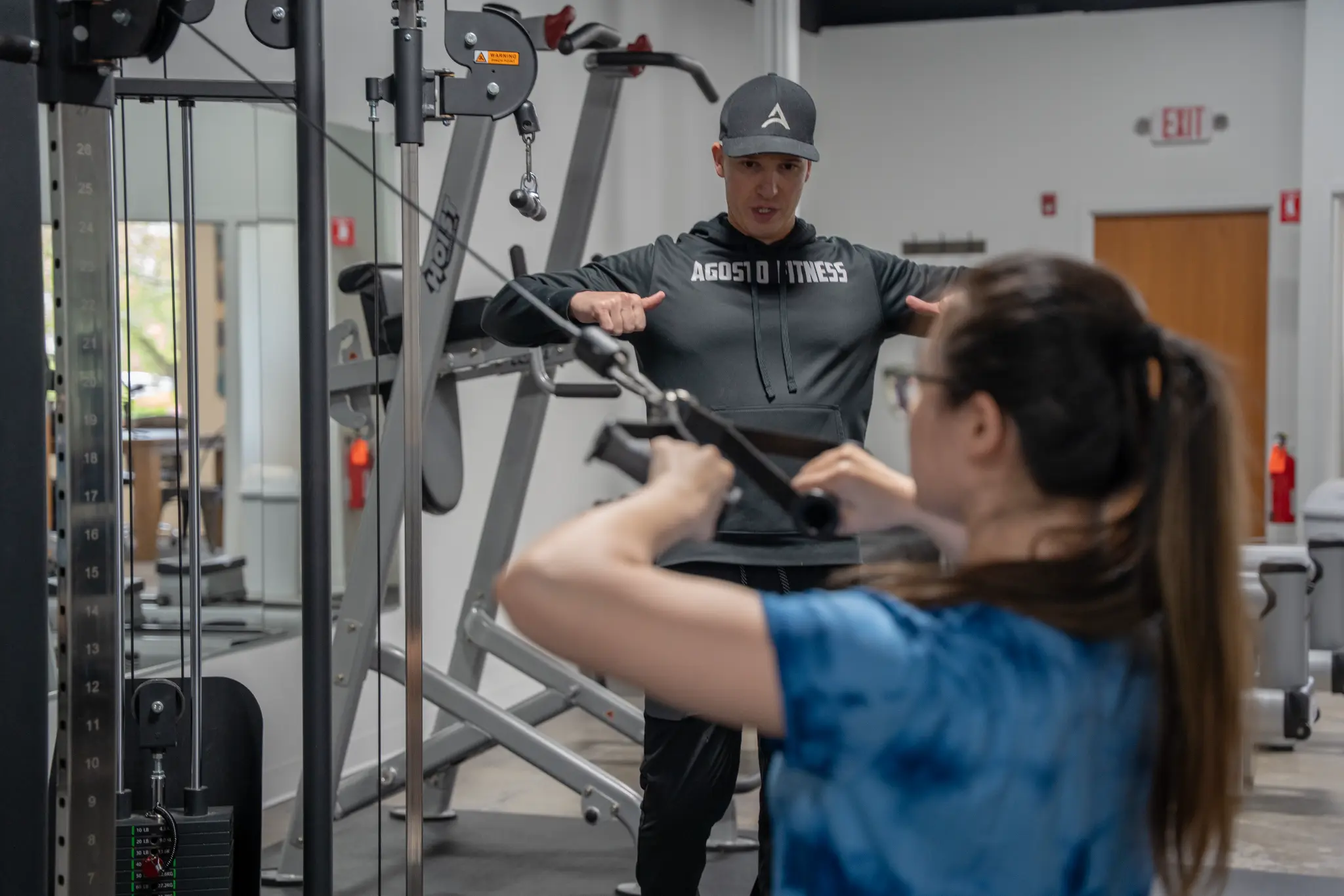 Garret Agosto coaching client on cable machine at Agosto Fitness private studio in Rochester NY