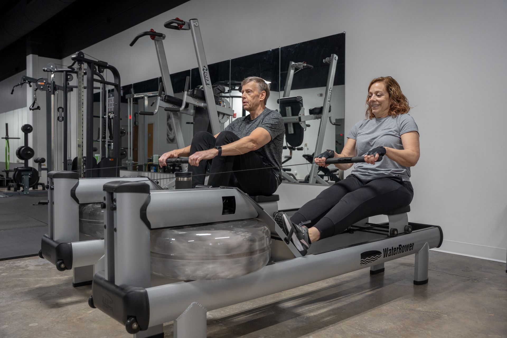 Couple doing partner personal training together at Agosto Fitness private studio Rochester NY