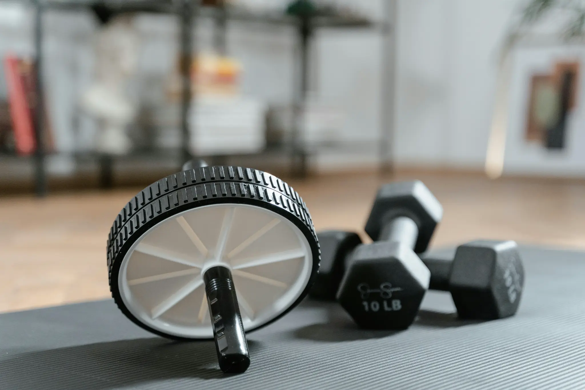 Ab wheel and dumbbells for home gym setup